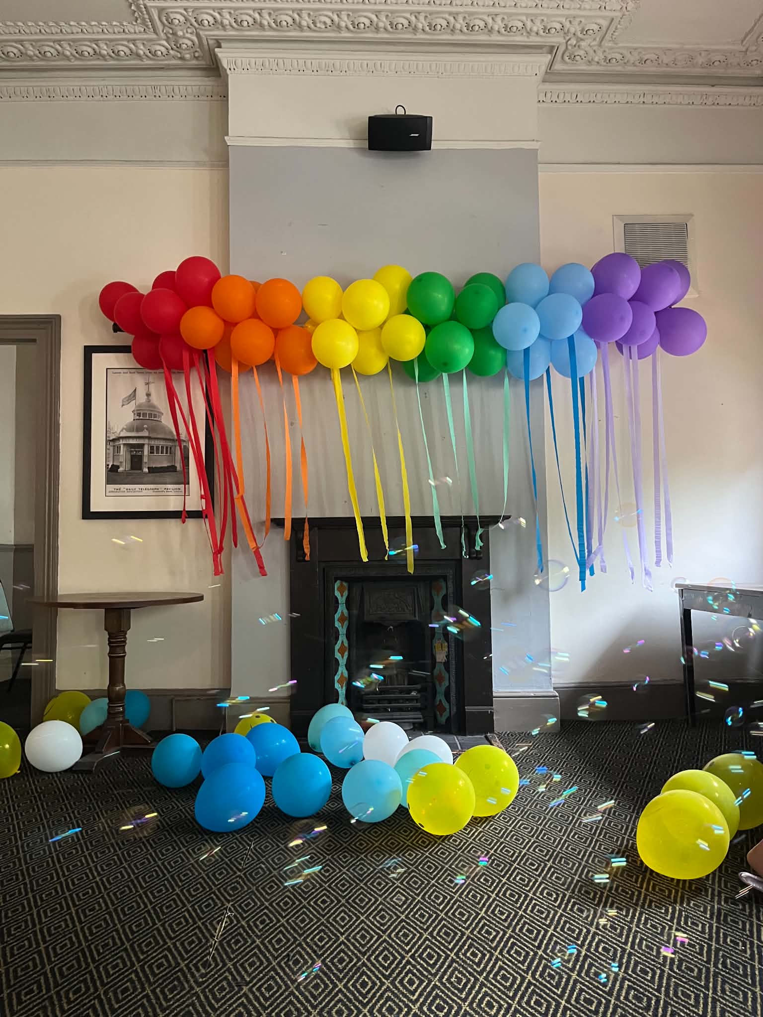 Colourful rainbow balloon decorations for a bright celebration.